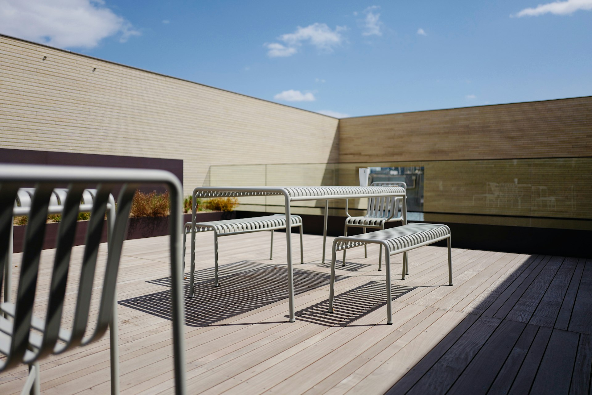 a table and chairs on a wooden deck